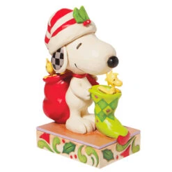 Enesco Jim Shore Peanuts Snoopy And Woodstock With Stocking Figurine, 7" 9 Enesco Jim Shore Peanuts Snoopy And Woodstock With Stocking Figurine, 7" -Hallmark Shop Jim Shore Snoopy Woodstock With Stocking Figurine 6008957 04